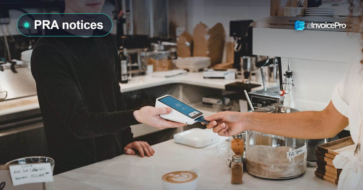 A customer paying by card at a café counter