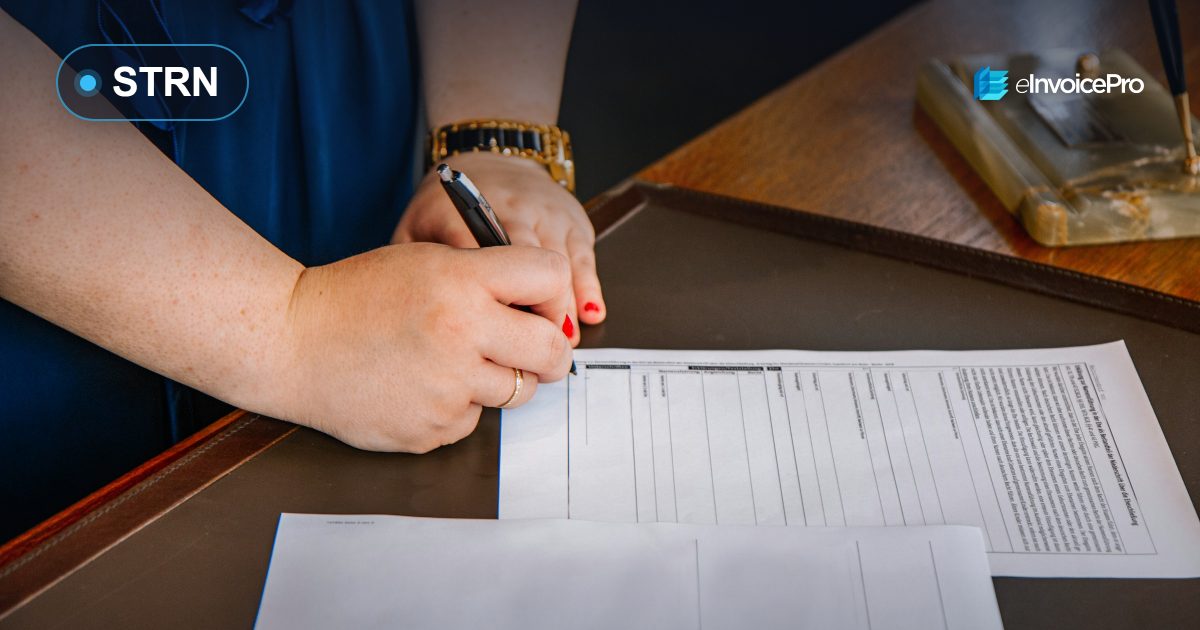 Filling in a registration form at an office desk